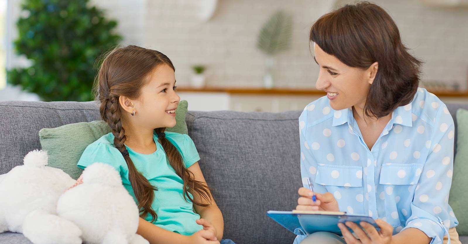 Social worker talking to a child