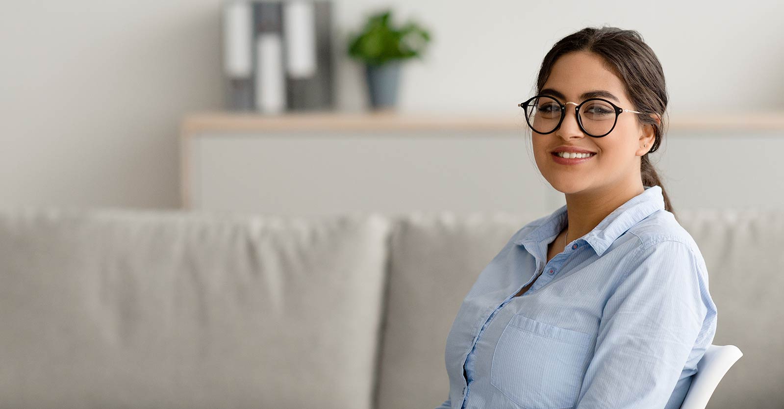 Woman smiling sitting in a chair