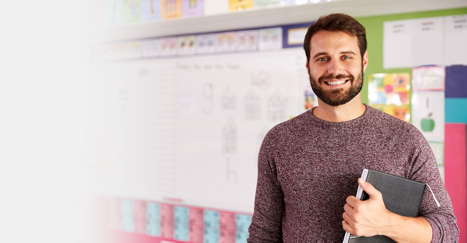 Man standing inside a classroom
