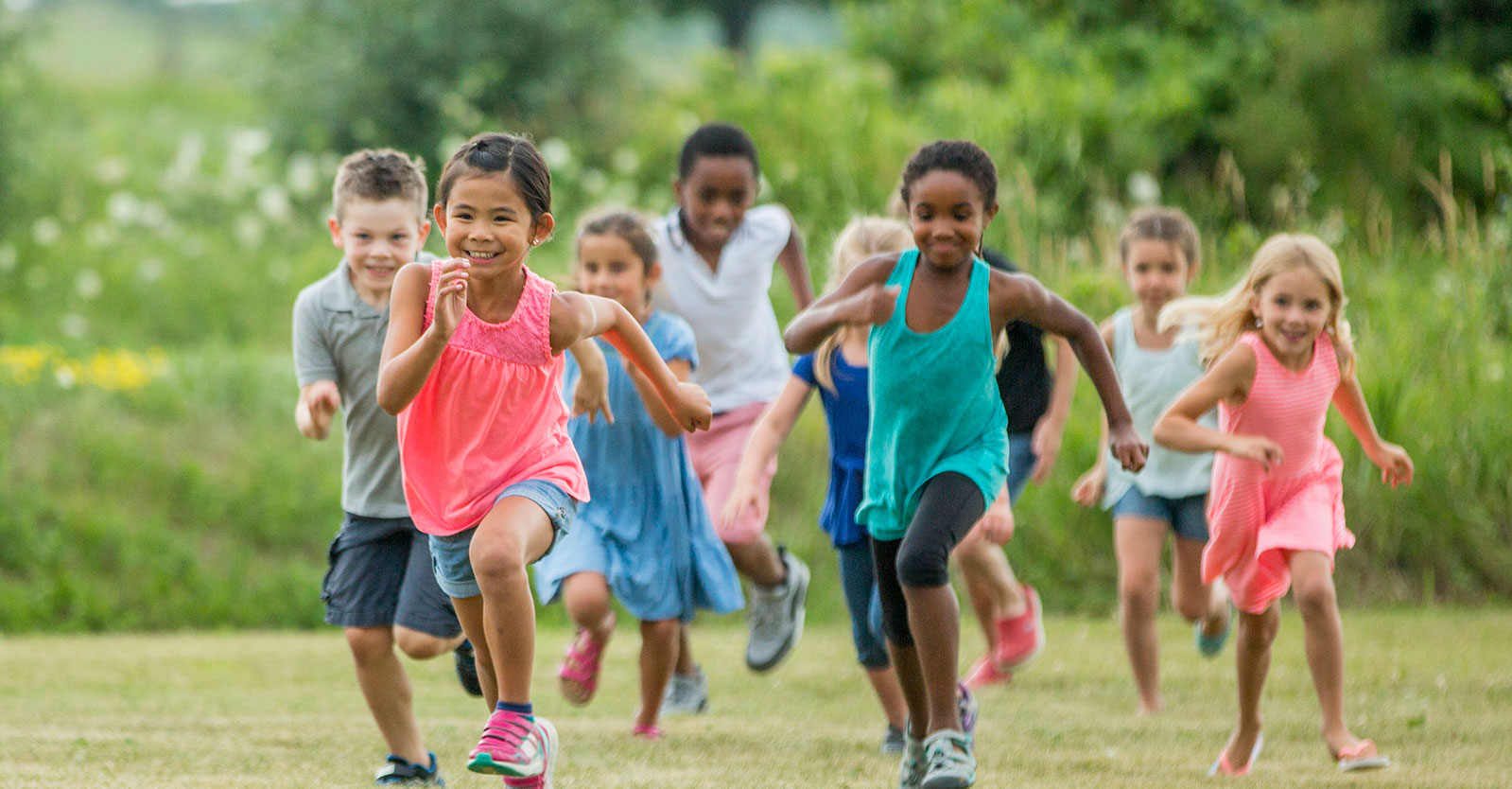 Children running in a field