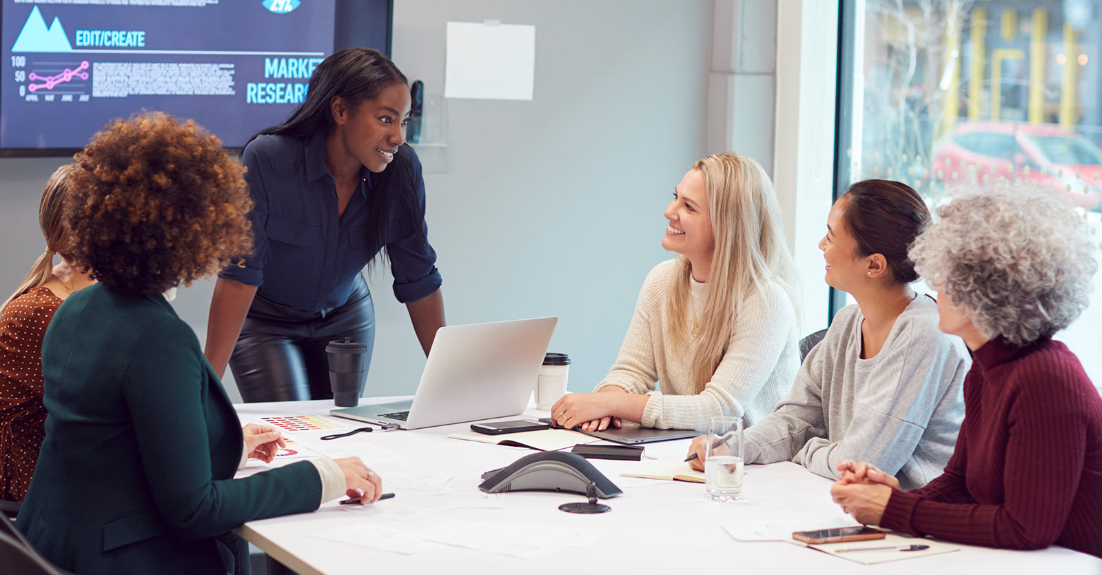 Woman presenting during a meeting