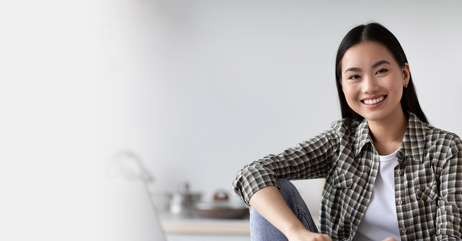 Woman with laptop computer on a counter