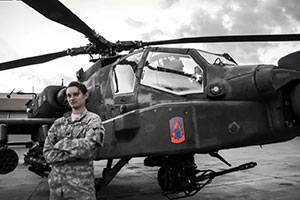 Kimberly Smith standing next to a helicopter