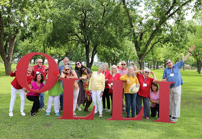 OLLI members holding big letters that spell OLLI