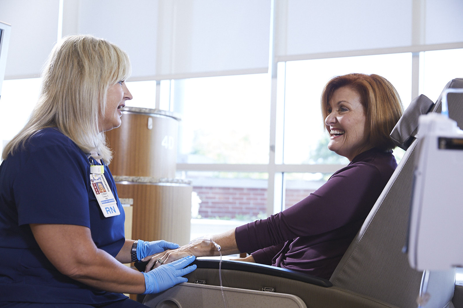 DCH nurse talking with a femail patient