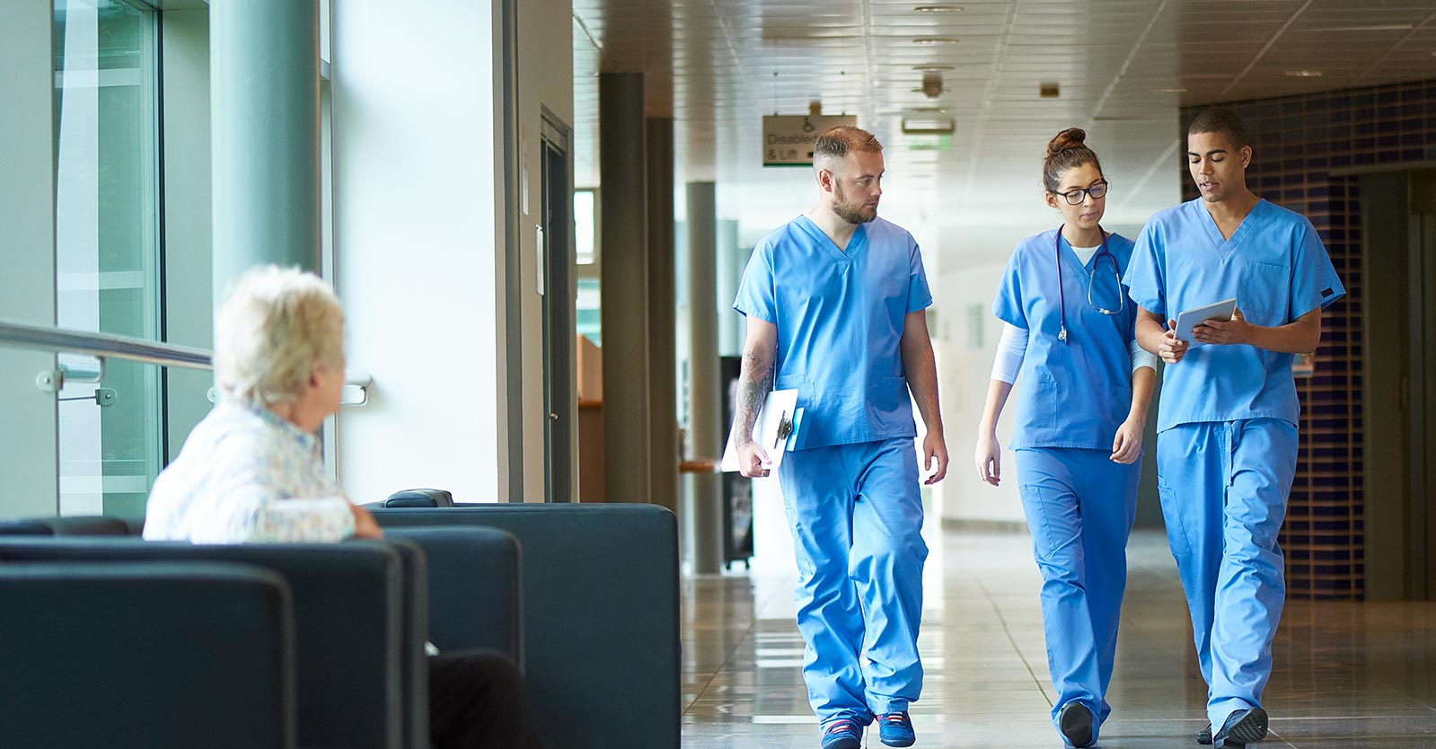 Nurses walking down a hallway