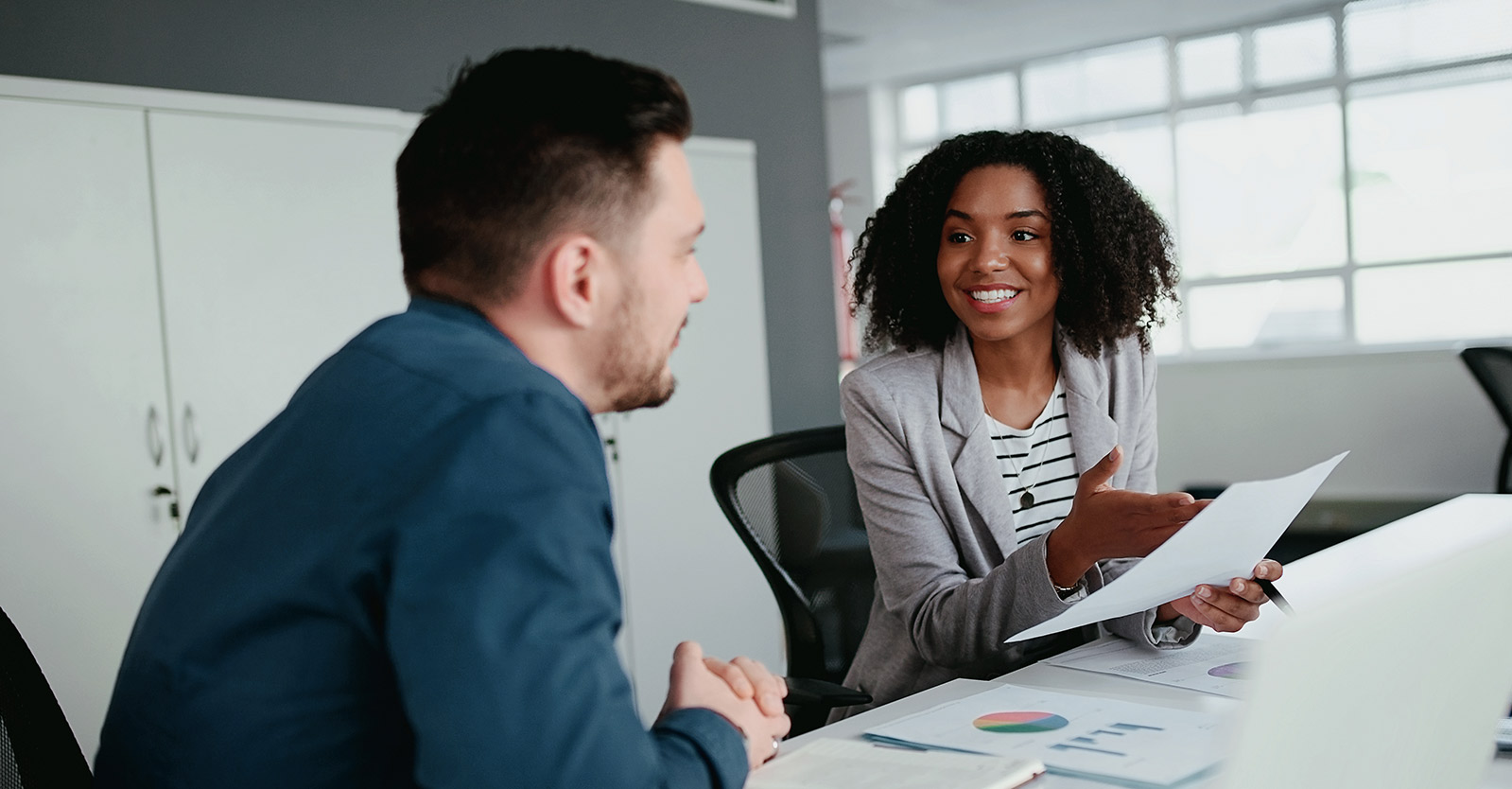Woman giving presentation in a meeting