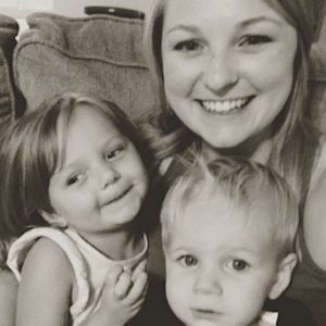 Tori Gulledge smiling with both of her children