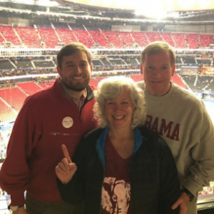 Keith with his wife and son at a Bama game