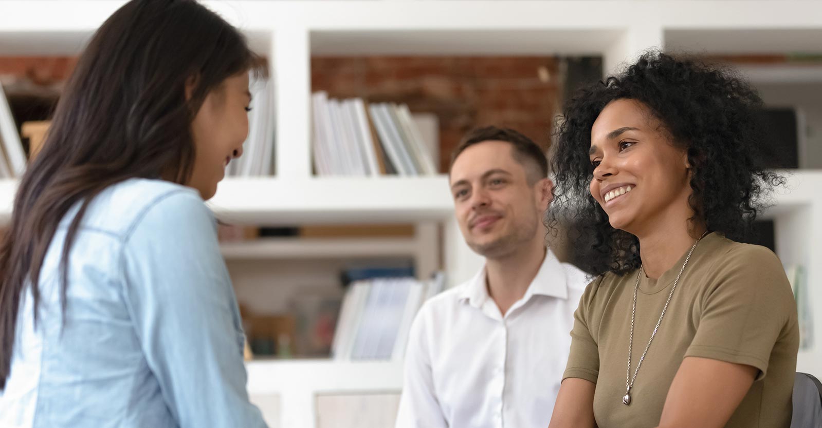 Couple talking to a woman