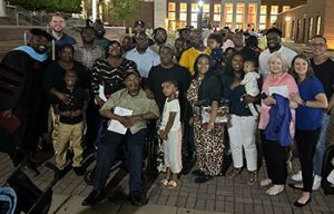 Demetrius at graduation with family and friends