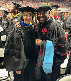 Demetrius with Dr. Joy Burnham at graduation