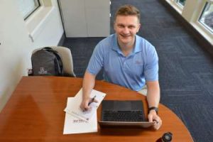 Nathan McDonald studying on laptop.